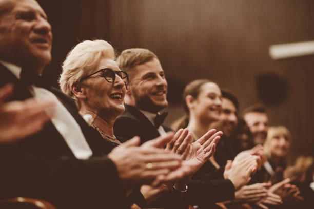 istock Spectators clapping in the theater 1409455477