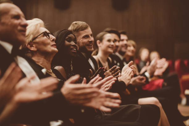 istock Spectators clapping in the theater 1409455605