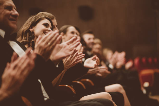 istock Spectators clapping in the theater 1409456454