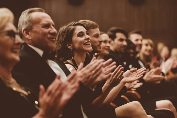 istock Spectators clapping in the theater 1409456615