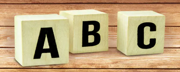 A B C letters on wooden cubes