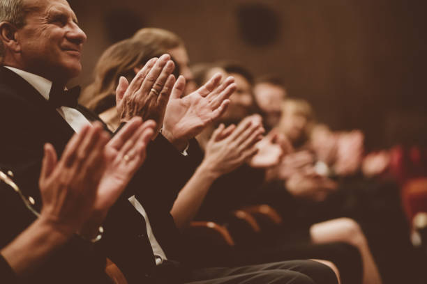 istock Spectators clapping in the theater, close up of hands 1409457045