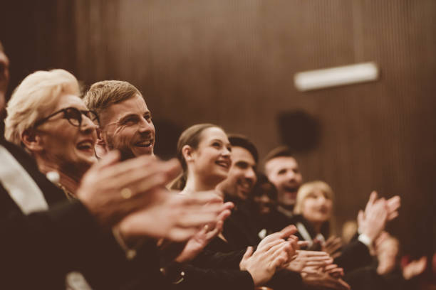 istock Spectators clapping in the theater, close up of hands 1409457814