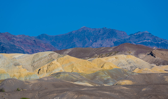 Colourful mountains at Zabriskie Point in Death Valley National Park, California, USA. Seen a hot day in the summer.