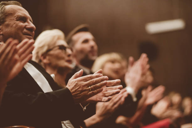 istock Spectators clapping in the theater, close up of hands 1409457936