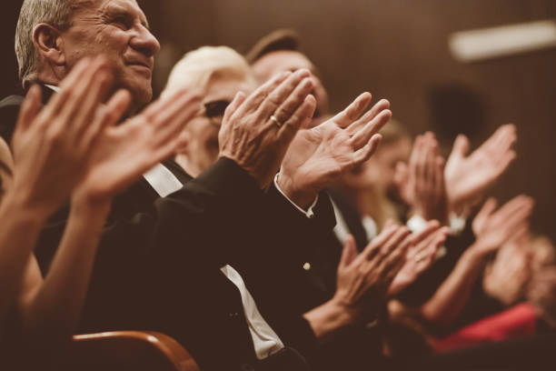 istock Spectators clapping in the theater, close up of hands 1409458084