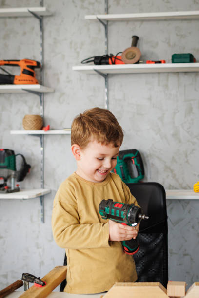istock Little boy enjoys carpentry 1409458133