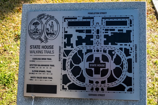 Las Vegas, NM: An information sign at the historic train station at Las Vegas, New Mexico, explaining Las Vegas’ history, as well as the history of local rail travel. In the distance is the historic Castañeda Hotel, renovated in 2019.