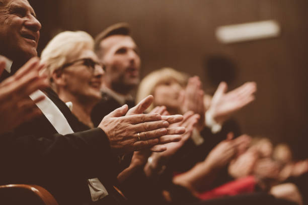 istock Spectators clapping in the theater, close up of hands 1409458238