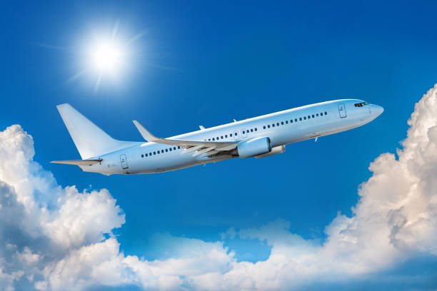 istock White passenger airliner takes off in the blue sky 1409458278