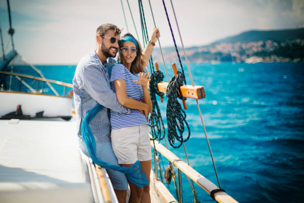 istock Young couple on a sailing cruise. 1409459386