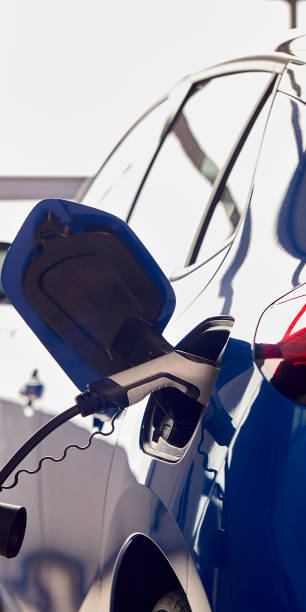 istock Charging Cable Attached To Environmentally Friendly Zero Emission Electric Car In Garage 1409460129