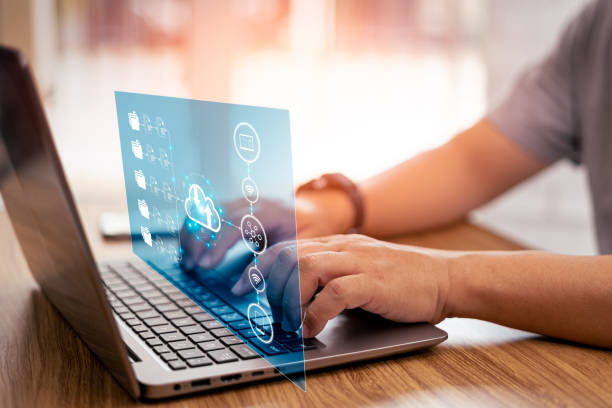 istock Document management and technology concept, Businessman use laptop and smartphone keep document data on cloud storage online technology with icons on virtual screen 1409460138