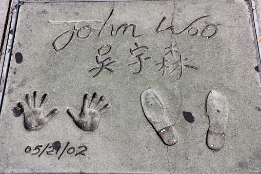 John Woo hand prints in front of TCL Chinese Theatre in Hollywood. The theatre has a collection of nearly 200 celebrity handprints and footprints.