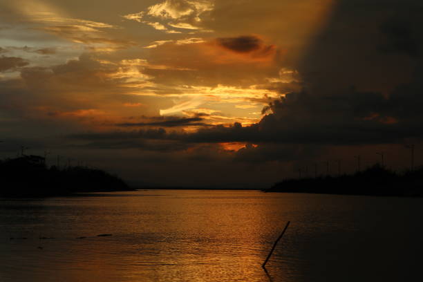 istock colorful dramatic sky with clouds at sunset. Sunset in  the lake 1409460991