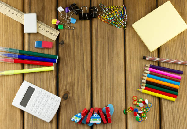 istock Office supplies on wooden table 1409461236