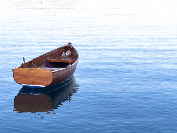 Lonely boat floating on the sea stock photo