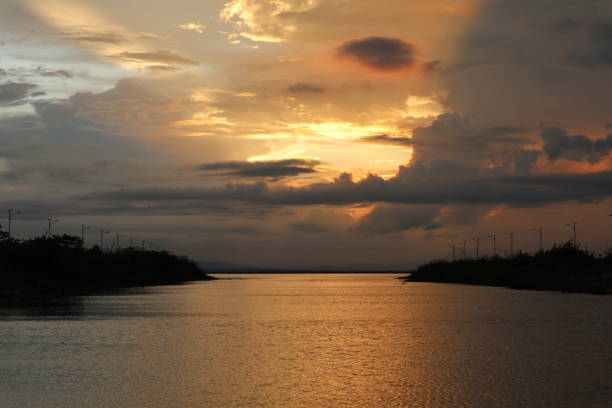 istock colorful dramatic sky with clouds at sunset. Sunset in  the lake 1409462458