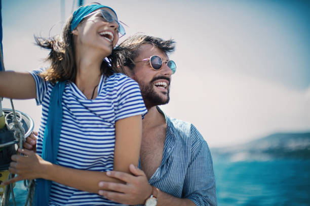istock Young couple on a sailing cruise. 1409462556