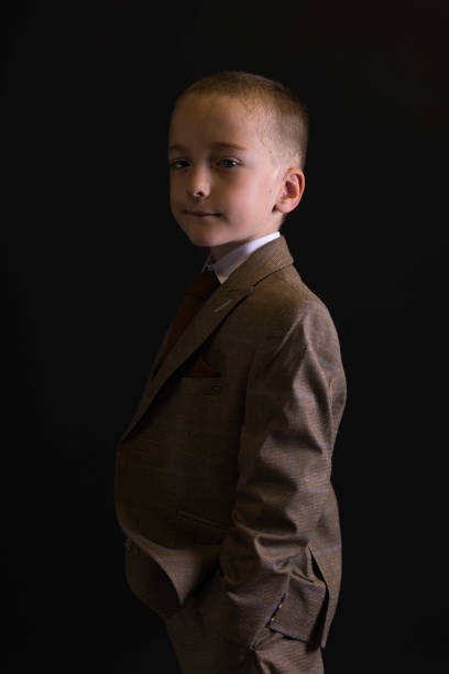 Young man on black background.