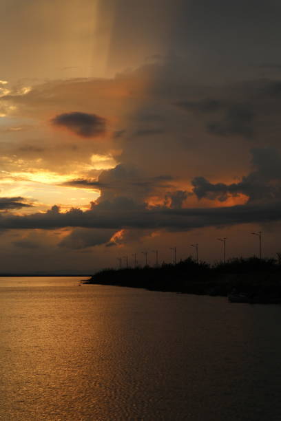 istock colorful dramatic sky with clouds at sunset. Sunset in  the lake 1409462833
