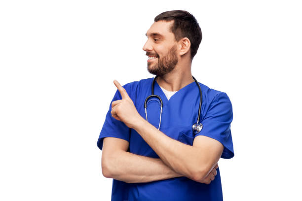 smiling doctor or male nurse with stethoscope - finger raised imagens e fotografias de stock