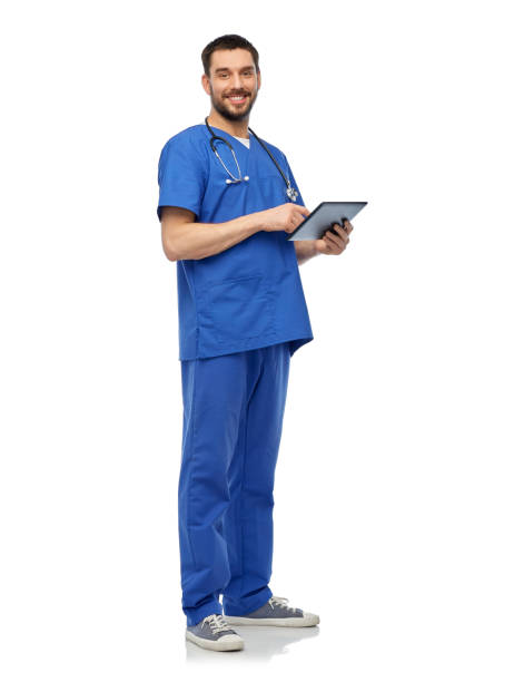 istock smiling doctor or male nurse using tablet computer 1409463261