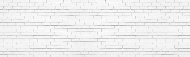 White painted old exterior brick wall. Whitewashed brickwork wide texture. Abstract light grunge vintage background