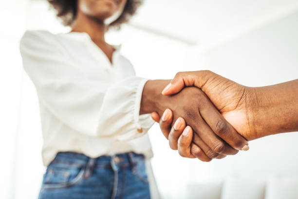 istock Happy multiethnic businesspeople shake hands 1409464441