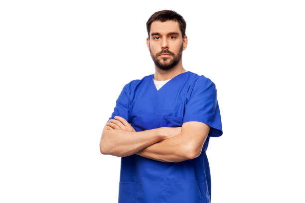doctor or male nurse in blue uniform stock photo