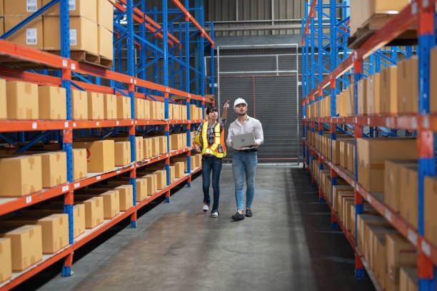 istock manager visit large warehouse for annual audit inventory stock check on racking 1409464938