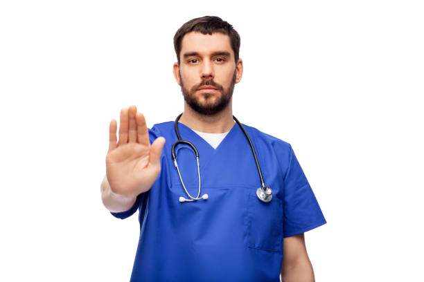 doctor or male nurse showing stop gesture