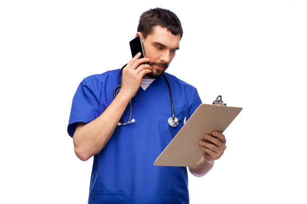 doctor or male nurse calling on smartphone - nurse on phone serious bildbanksfoton och bilder