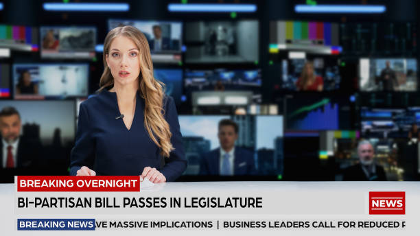 istock TV Live News Program with Professional Female Presenter Reporting. Television Cable Channel Anchorwoman Talks. Mockup of Network Broadcasting in Newsroom Studio Concept. Medium Shot. 1409469307