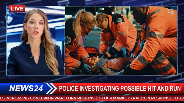 istock Breaking TV News Live Report: Anchor Talks While Split Screen Edit: Ambulance Driving to Road Accident, ER Team Saving Car Crash Victim. Television Program on Cable Channel Concept. 1409469988