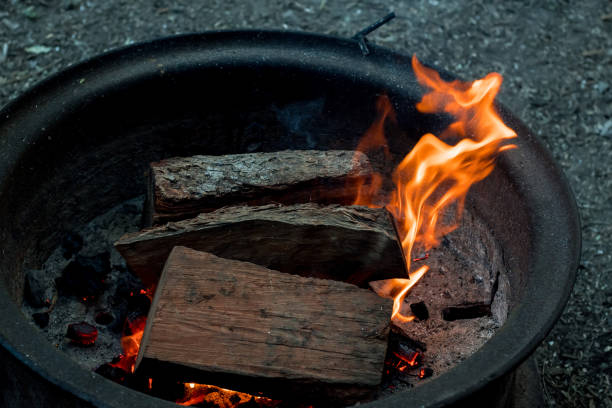 istock Campfire burning in a firepit . Camping life. Outdoor recreation. Selective focus 1409470237