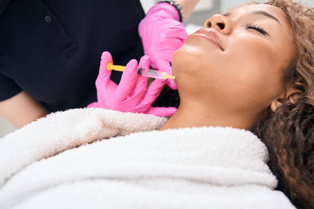 istock Patient undergoing a chin correction procedure with botulinum toxin injections 1409471083