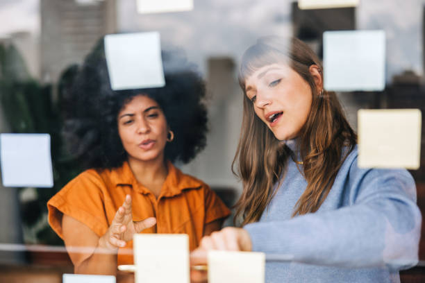 Creative businesswomen brainstorming in an office stock photo