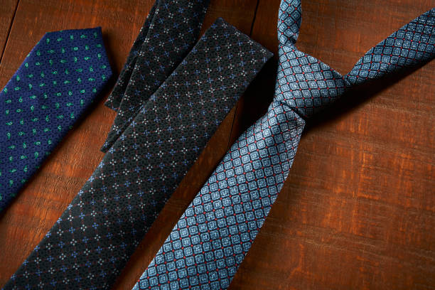 istock Blue ties on a wooden background 1409472325