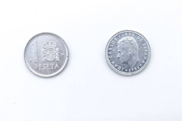 istock 1 pesetas old spanish coins on white background 1409473762