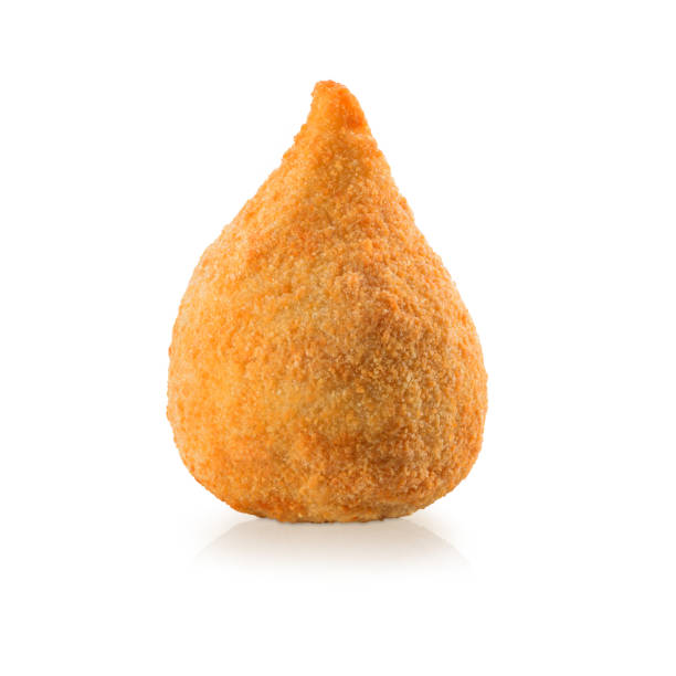 Delicious deep fried brazilian snack, coxinha, isolated on white Delicious deep fried brazilian snack, coxinha, isolated on white coxinha stock pictures, royalty-free photos & images