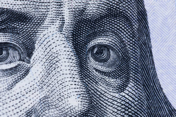 istock Dollars closeup. Benjamin Franklin's portrait on one hundred dollar bill. 1409473855