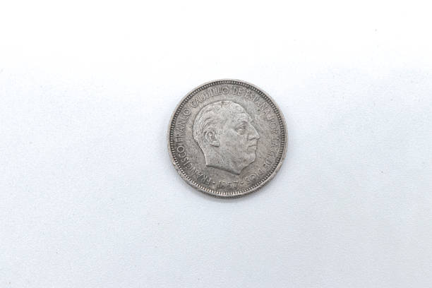 istock 5 pesetas 1957 old spanish coins on white background 1409473953