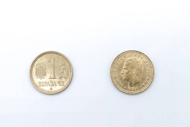 istock 1 pesetas old spanish coins on white background 1409474011