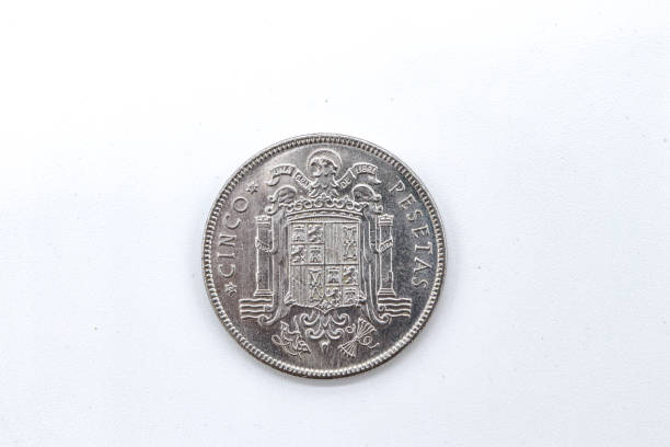 istock 5 pesetas 1949 old spanish coins on white background 1409474150