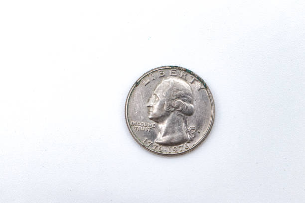 istock quarter dollar coins on white background 1409474169