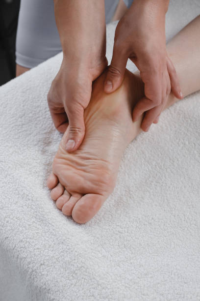 istock Professional reflexology foot massage close up 1409475404