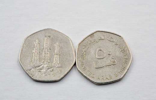 Modern United Arab Emirates dirham coins used closeup on the white background