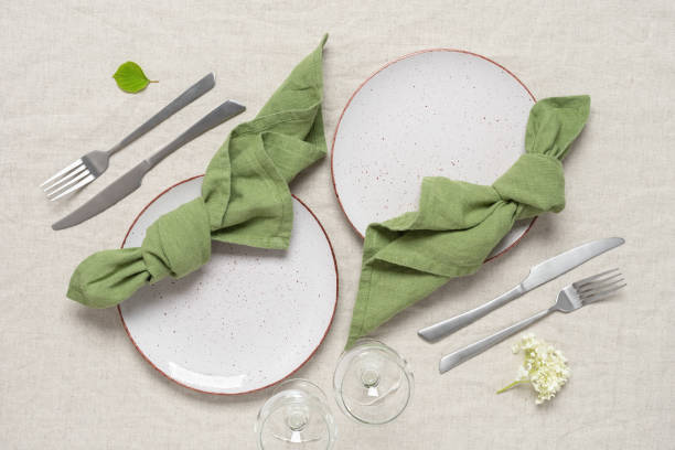 istock Festive table setting for two persons. Beautiful serving with natural fabrics and flowers. Top view, flat lay. 1409476926