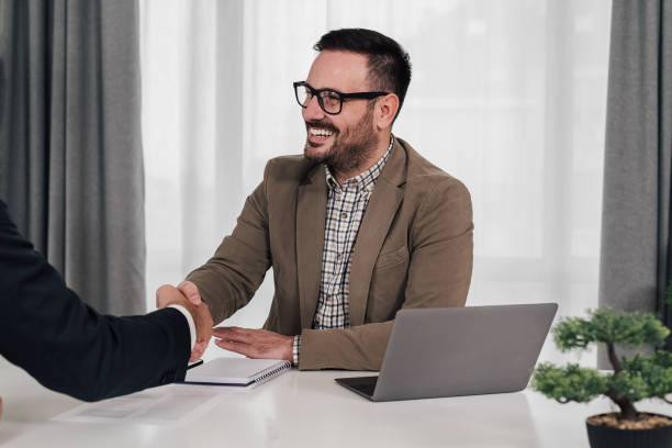 istock Happy businessman shaking hands with partner. 1409478153